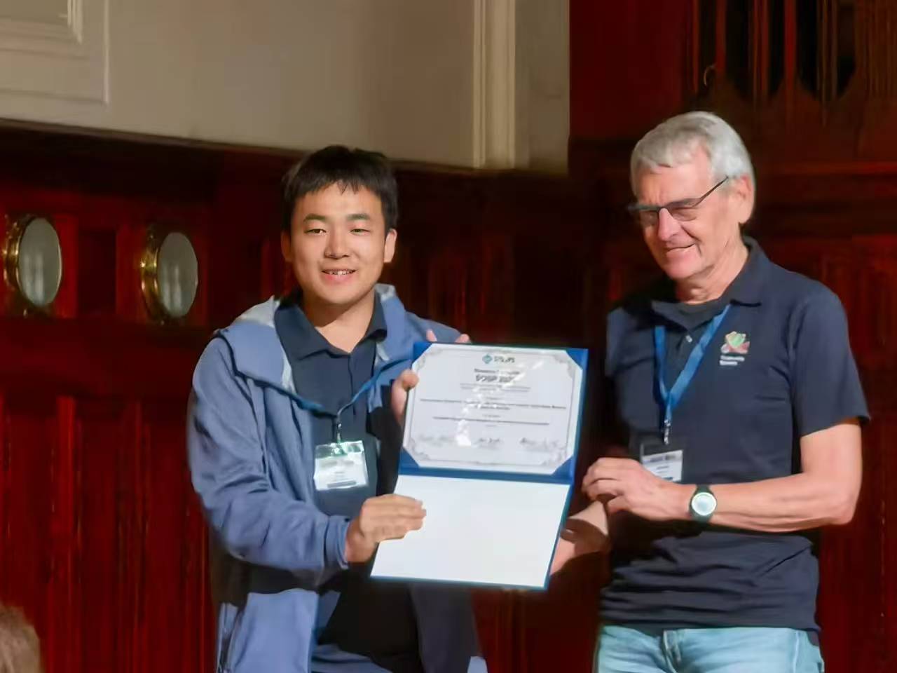 Junyang Zhang receiving the 2026 SIGOPS Research Highlight Award for CortenMM