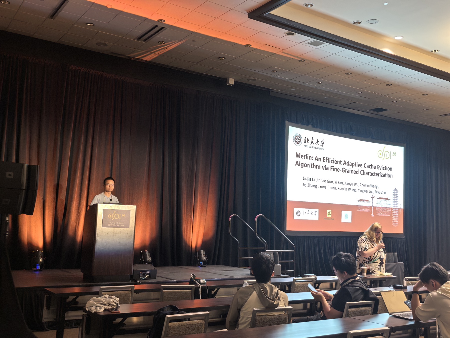 Kang Hu presenting MultiLane at OSDI 2026