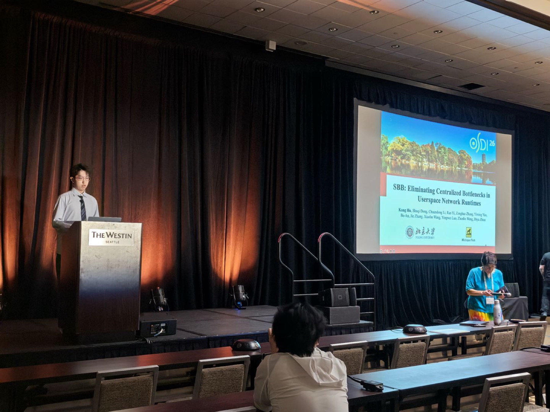 Liujia Li presenting Merlin at OSDI 2026